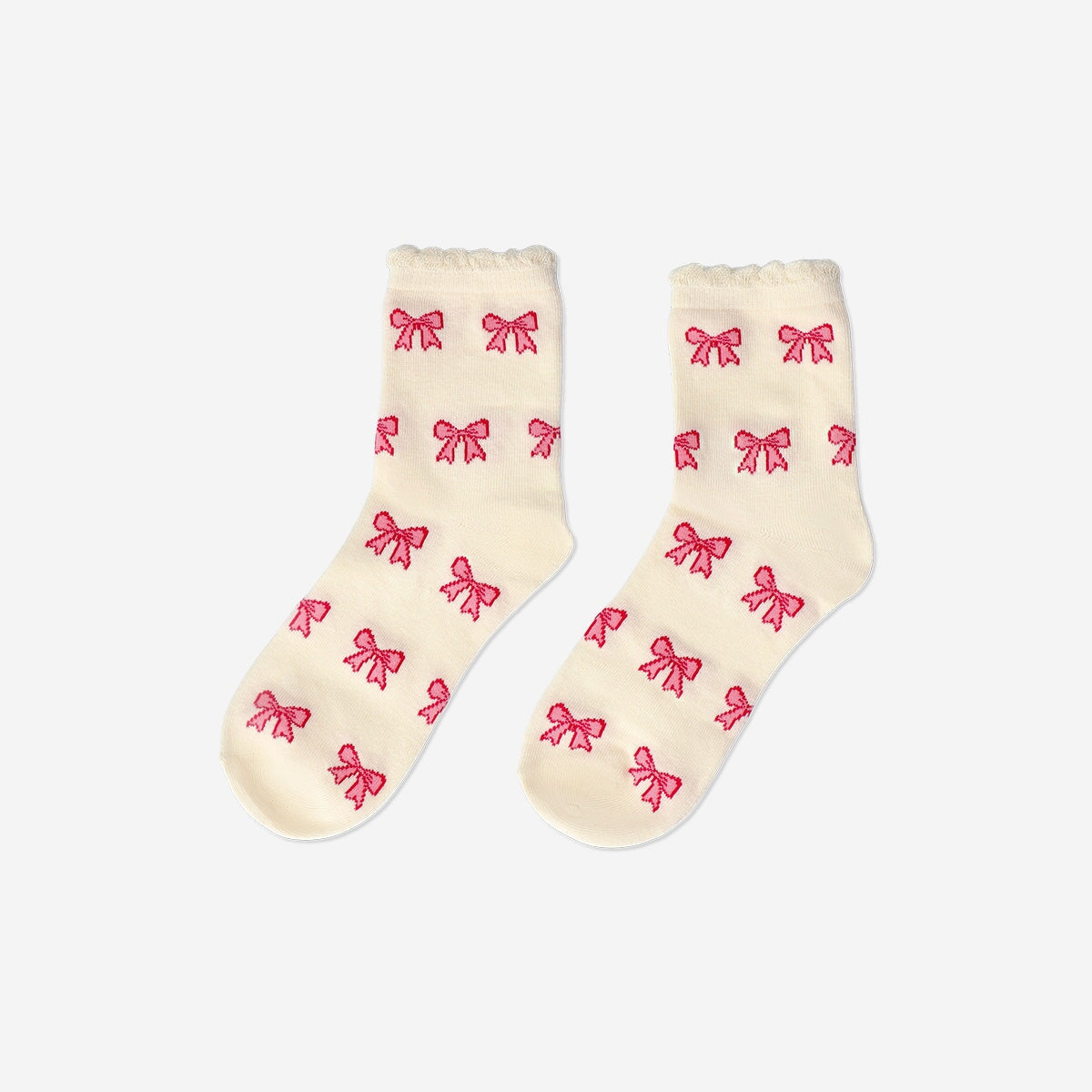 Pink textile socks with bows from Flying Tiger Copenhagen, size 36/38, featuring a soft fabric and decorative bow accents.
