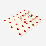 Textile tote bag with red heart designs from Flying Tiger Copenhagen, featuring a casual, fashionable tote bag look.