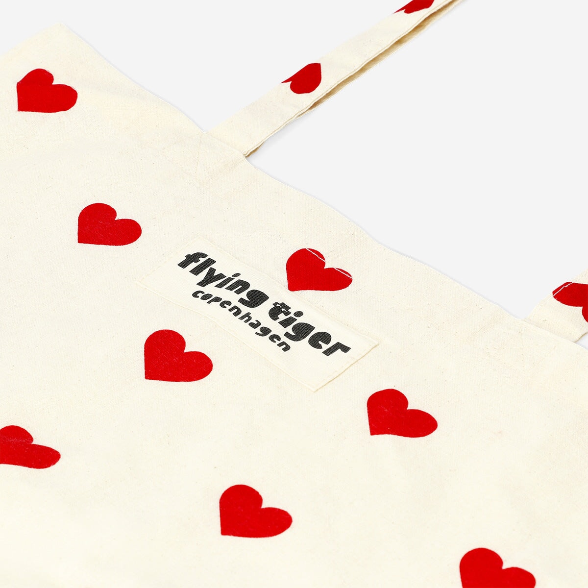 Flying Tiger Copenhagen textile tote bag with red heart patterns, casual and stylish for everyday use.