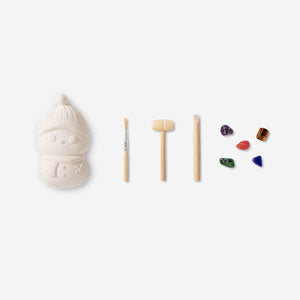 Flying Tiger Copenhagen Christmas excavation toy kit with festive-themed tools and hidden treasures for kids to discover.