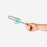 Magnetic spinning wheel on rails toy by Flying Tiger Copenhagen, featuring colorful wheels and sleek metal tracks for kids.