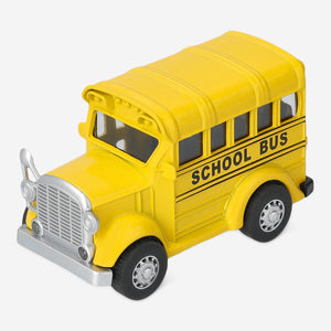 Yellow schoolbus toy by Flying Tiger Copenhagen, pull-back car with bright color and detailed school bus design.