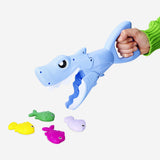 Flying Tiger Copenhagen Shark Sand Grabber toy, colorful plastic tool for catching sand and small objects at the beach.