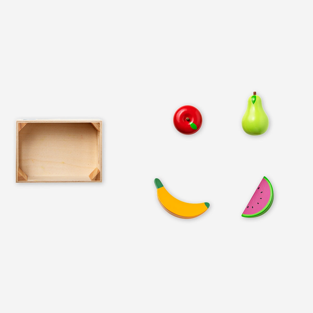 Wooden toy basket of four fruit pieces from Flying Tiger Copenhagen, includes apples, bananas, and oranges for imaginative play.
