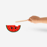 Wooden watermelon percussion toy from Flying Tiger Copenhagen, featuring colorful, textured wood for fun musical play.