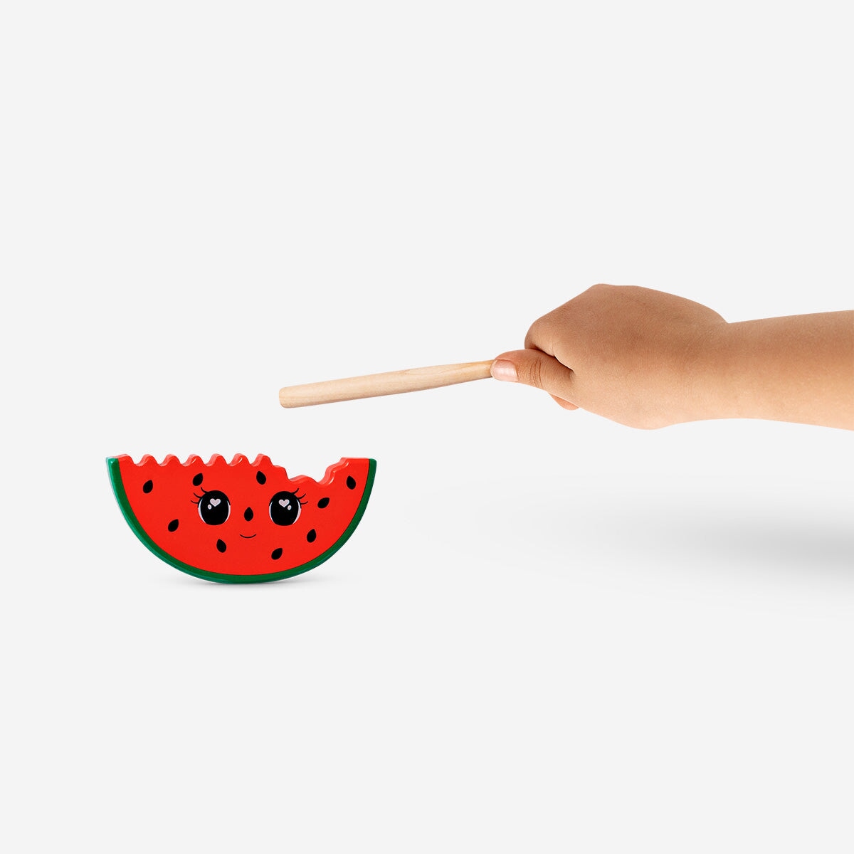 Wooden watermelon percussion toy from Flying Tiger Copenhagen, featuring colorful, textured wood for fun musical play.
