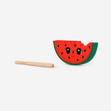 Wooden watermelon percussion toy by Flying Tiger Copenhagen, featuring colorful, textured wooden slices for kids' musical play.