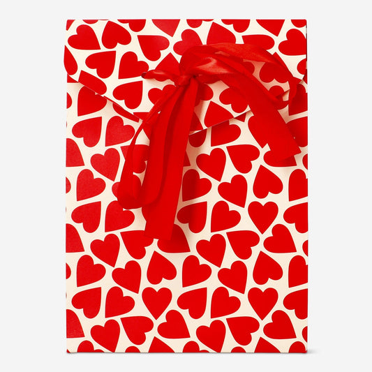 Gift bag with red hearts and bow