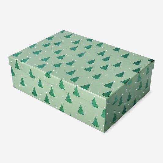 Caja de regalo verde con árboles