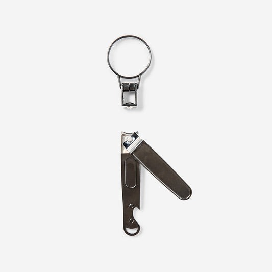 Nail clipper with bottle opener and magnifying glass