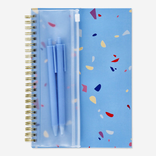 Notebook with writing utensils