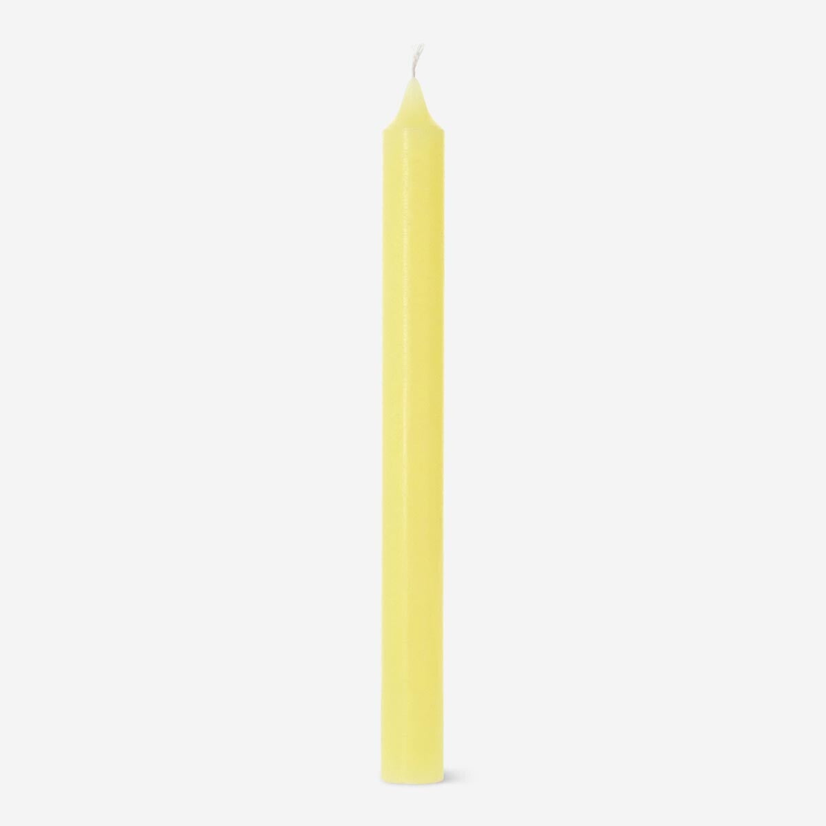 Yellow dinner candle from Flying Tiger Copenhagen, 24 cm tall, shown burning on a dining table for home decor.