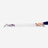 Flying Tiger Copenhagen Poo Curling Game gadget featuring colorful miniature curling stones and a gameboard for fun indoor play.