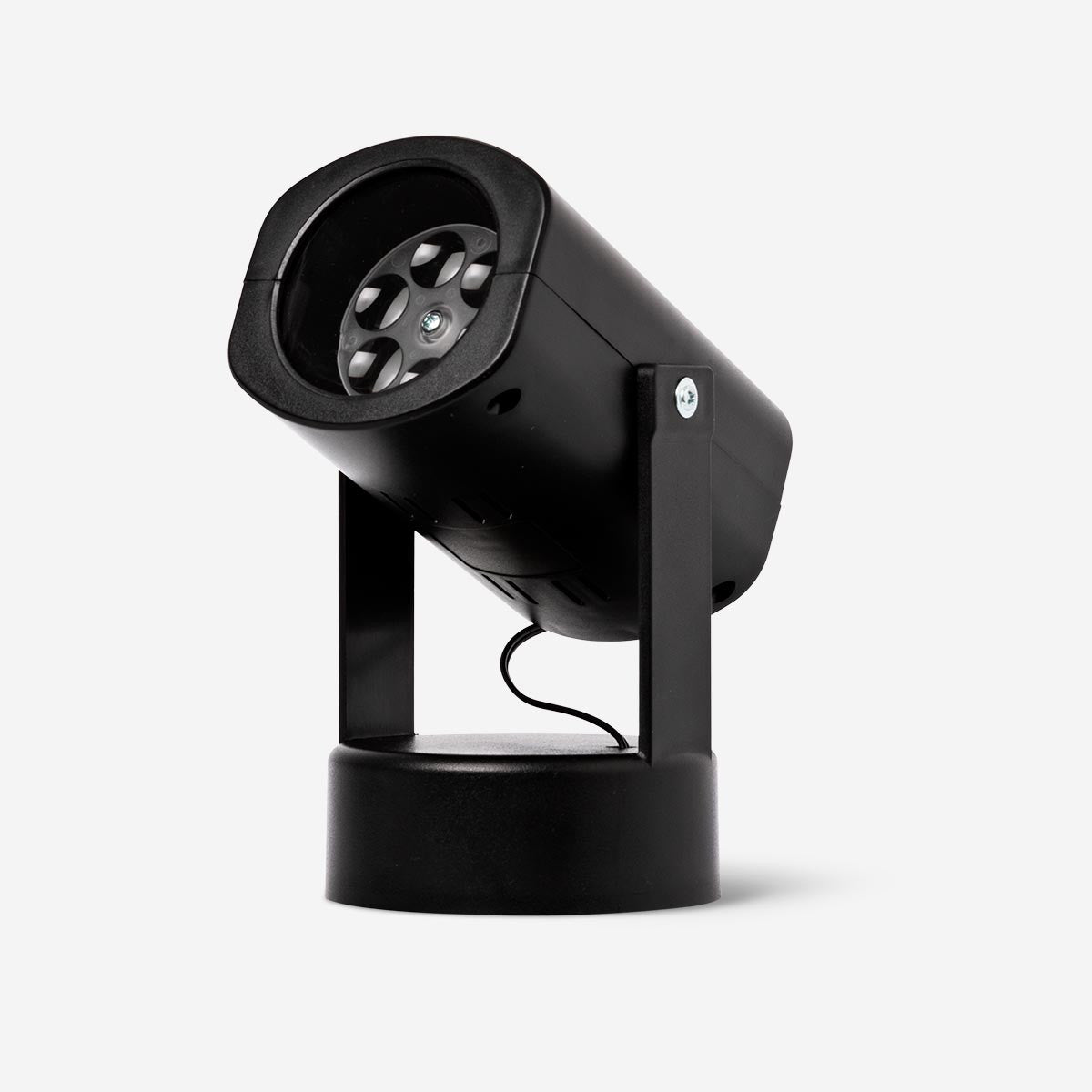 Flying Tiger Copenhagen projector lamp gadget illuminated with colorful projection on a surface, compact and modern design.