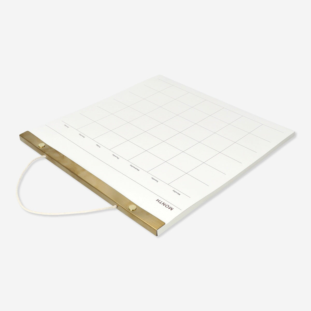 Hanging monthly office planner by Flying Tiger Copenhagen with calendar pages and colorful design for organized scheduling.