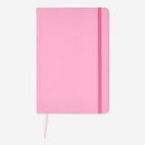A5 office notebook by Flying Tiger Copenhagen with a simple cover, open pages showing lined paper for note-taking.