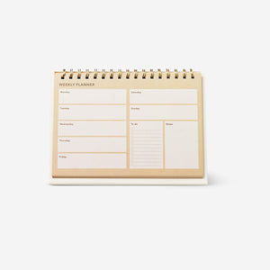 Flying Tiger Copenhagen weekly planner for office use, featuring a clean, organized layout with date sections and colorful accents.