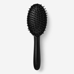 Black hairbrush by Flying Tiger Copenhagen for personal care, with a sleek design and comfortable grip.