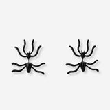 Pair of stylish earrings from Flying Tiger Copenhagen, featuring modern design and shiny metallic finish.