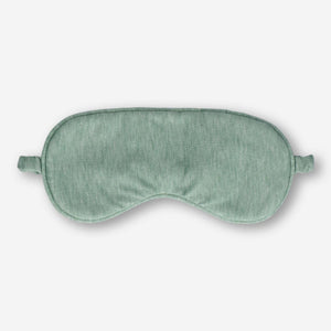 Green sleeping mask from Flying Tiger Copenhagen, soft fabric sleep mask for comfort and relaxation during rest.