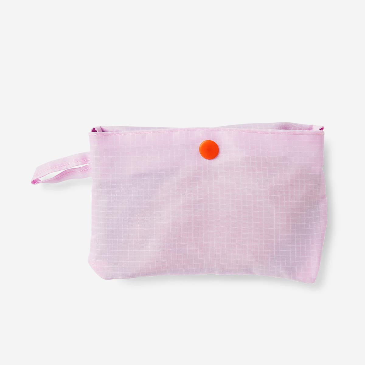 Foldable textile bag by Flying Tiger Copenhagen shown folded flat, with colorful fabric and compact design for easy carrying.
