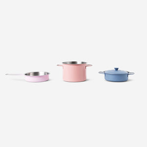 Toy play kitchen set with four pots and pans by Flying Tiger Copenhagen, featuring colorful cookware and utensils for imaginative play.