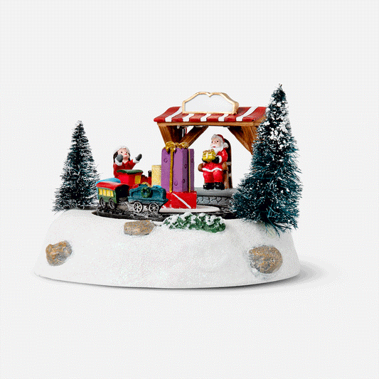 A karácsonyi falu jelenete. Fénnyel és zenével